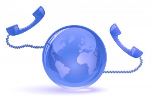 Globe and phone receivers. VoIP. Global communication concept.